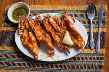 Grilled tiger prawns in a plate, close up