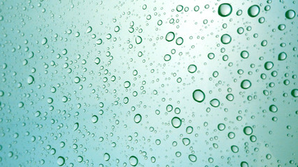 Close-up of water drops on glass surface as background
