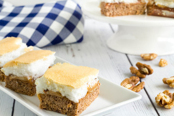 Healthy homemade cake with walnut, apple and baked egg-whites on top. No sugar, no flour.