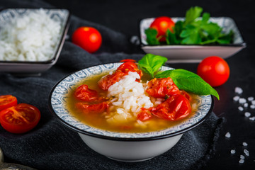 Fresh tomato soup with rice and cherry tomatoes