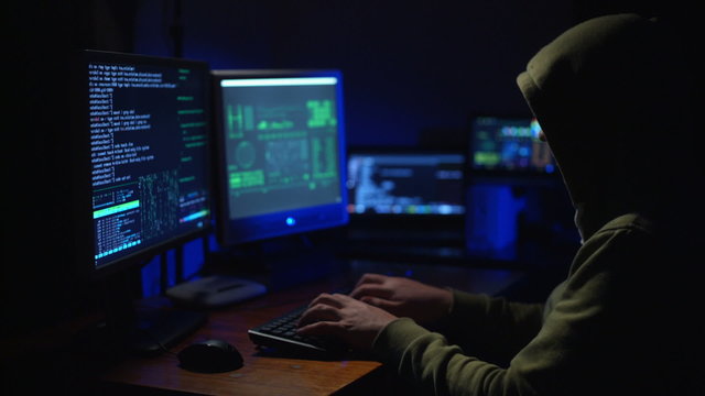 A Man Hacker at the Computer 
