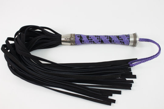 black flogger with metal detail and engraved