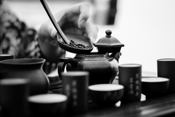 Process of the tea ceremony with authentic utensils  black and white close-up