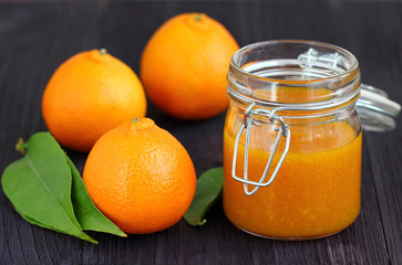 tangerines and  jam in glass jar