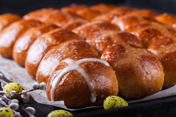 Easter Hot Cross Buns on a dark background.selective focus.