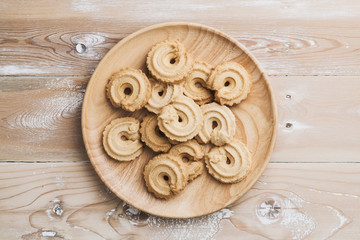 Danish butter cookies on wood table, top view