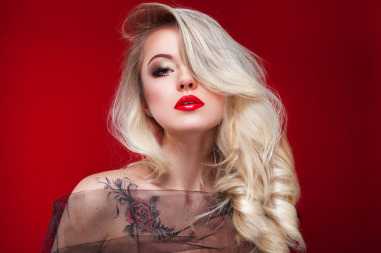 Glamour elegant blond woman with red provocate lips over bright