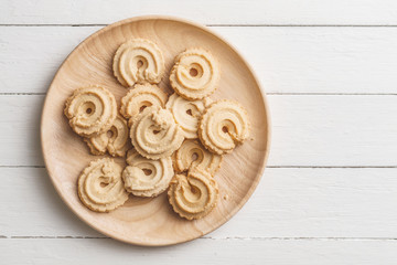 Danish butter cookies on wood table, top view