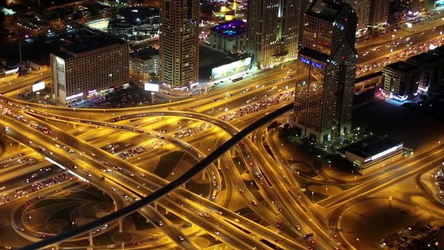 Dubai downtown at night, United Arab Emirates. View on Sheikh Zayed road from the 124th floor of Burj Khalifa skyscraper in Dubai, currently the tallest structure in the world, 829,8 m or 2,722 ft
