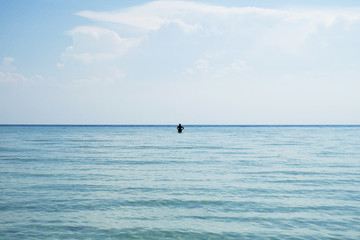 Fototapeta na wymiar Alone in the sea
