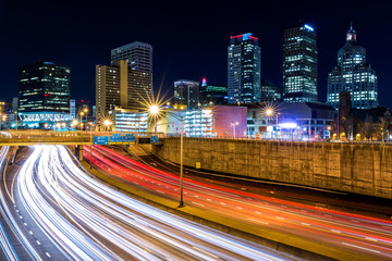 Hartford skyline by night, with rush hour traffic on Yankee expressway. Hartford is the capital of Connecticut.