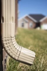 Gutter Downspout showing house in background
