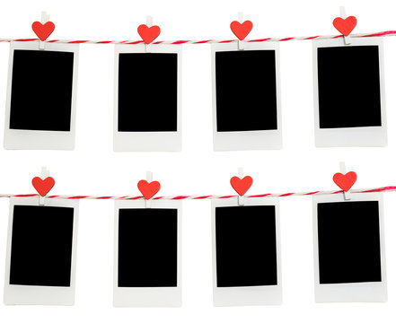 8 Blank instant photo and red clip paper heart hanging on the clothesline with white background.Designer concept.