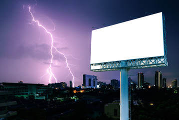 Blank billboard for advertising with strike of lightning into building.