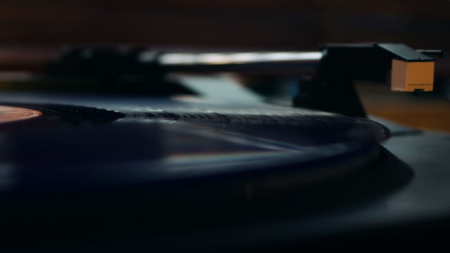 Vinyl record starting to play on a turntable.