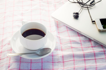 coffee cup and  laptop. modern office desktop