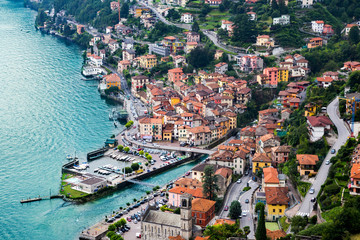 Fototapeta na wymiar High resolution aerial view of the picturesque colorful Italian town Argegno by Lake Como. European vacation, living life style, architecture and travel concept.