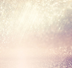 Fototapeta premium glitter vintage lights background. gold, silver, blue and white. de-focused. 