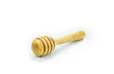 wooden honey dipper on background