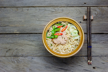 instant noodle in a bowl on a wooden background