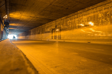 highway road tunnel with light coming from the exit