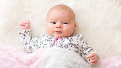Newborn baby girl on her blanket