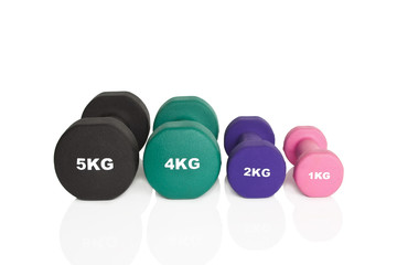Obraz na płótnie Canvas Fitness dumbbells. Black, green, purple and pink dumbbells isolated on white background. Weights for a fitness training.