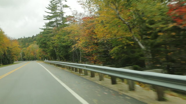 3 clips driving along the Swift River on the Kancamagus (Kanc) Highway during Autumn in the White Mountains of New Hampshire; POV is angled right, off of road.