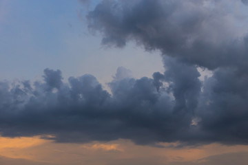 rain cloud on sunset sky background