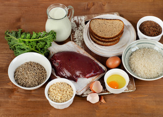 Foods Highest in Thiamin (Vitamin B1) on a wooden background.