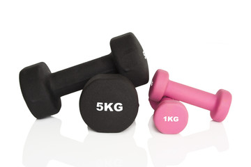 Fitness dumbbells. Pink 1 kg and black 5 kg dumbbells isolated on white background. Weights for a...