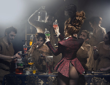 Woman in sexy jacket, picks a fresh smell. In the background, perfumers, scientists from the bottles and reagents.