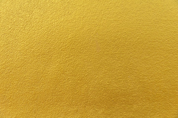 Cement background with a texture of gold wall