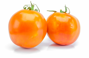 fresh red-yellow tomato on white background.