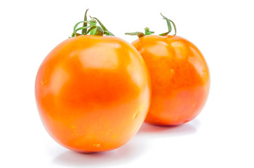 fresh red-yellow tomato on white background.