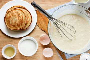 Fototapeta na wymiar Cooking pancakes for breakfast. Ingredients for making pancakes