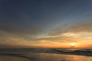 Naklejka na ściany i meble sunset dramatic sky with colorful cloud on the beach