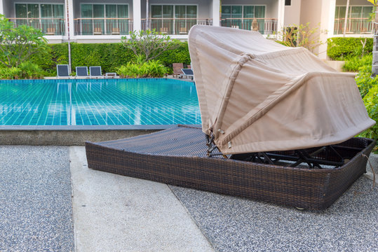 pool bed near swimming pool in tropical resort
