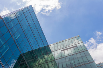 skyscraper against sky and building in city