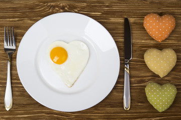  breakfast with scrambled eggs in  heart-shaped Valentine's Day