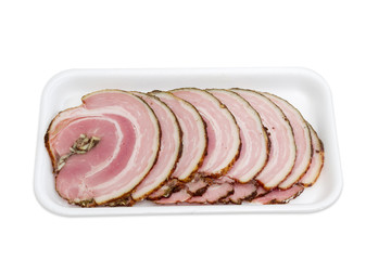 Sliced roll of a baked pork on plastic tray