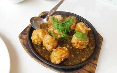 Squid balls serving on the hot plate