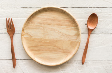 Empty wooden plate  on wooden table