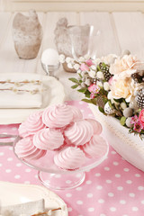 Obraz na płótnie Canvas Pink meringues on the easter table