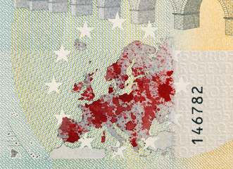 Close-up of a 5 euro bank note, stained with blood