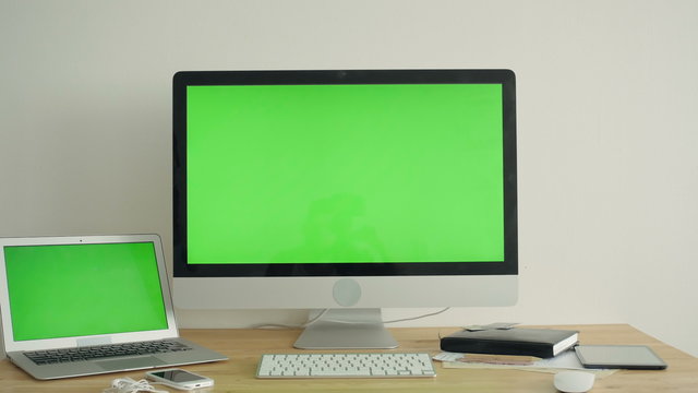 PC Display With Green Screen On The Table