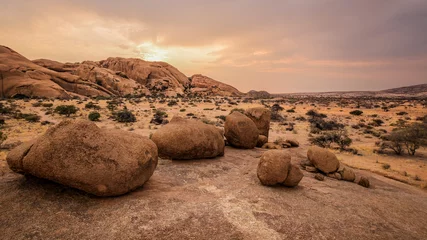 Foto op Aluminium Typical round stones in the Namibian savanna at sunset  © Gian78