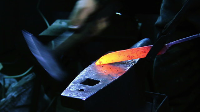 Blacksmith Forging a Knife
