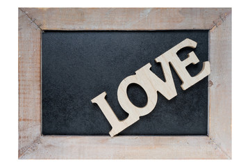 Love / Wooden blackboard with wooden letters and the word Love