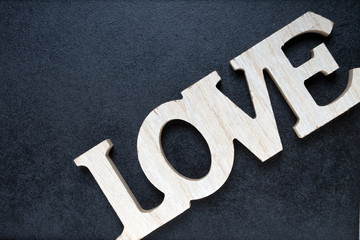 Love / Blackboard with wooden letters and the word Love